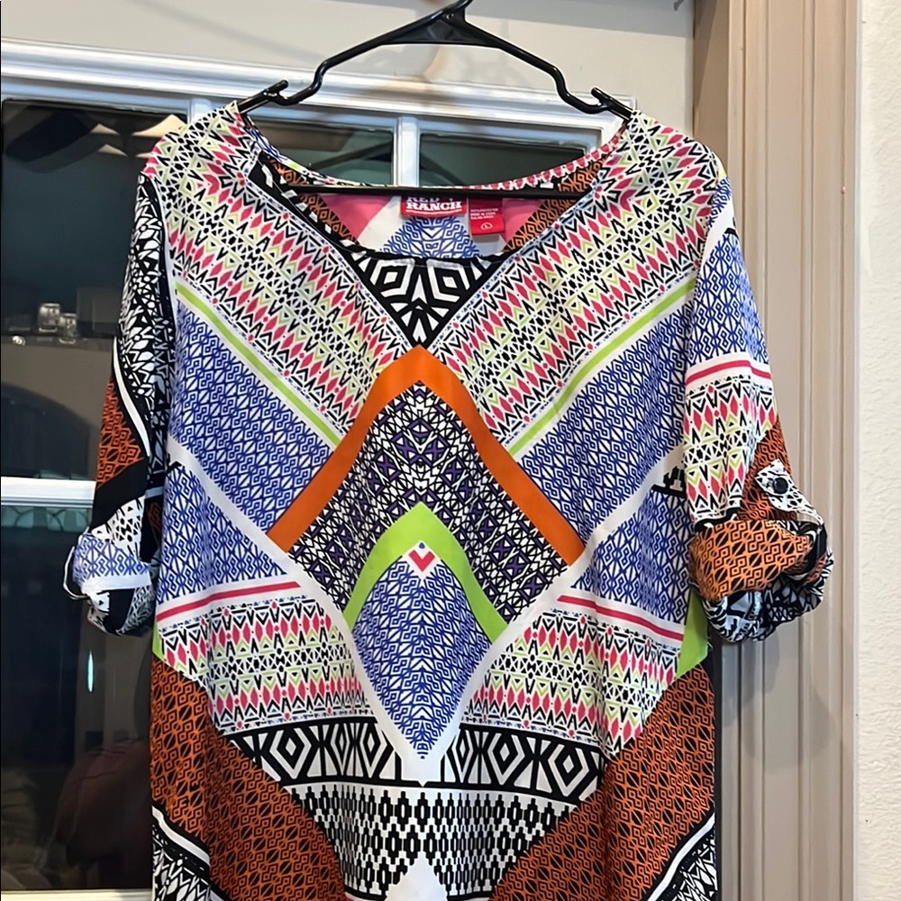 Blue and Orange Graphic Blouse with Dynamic Patterns